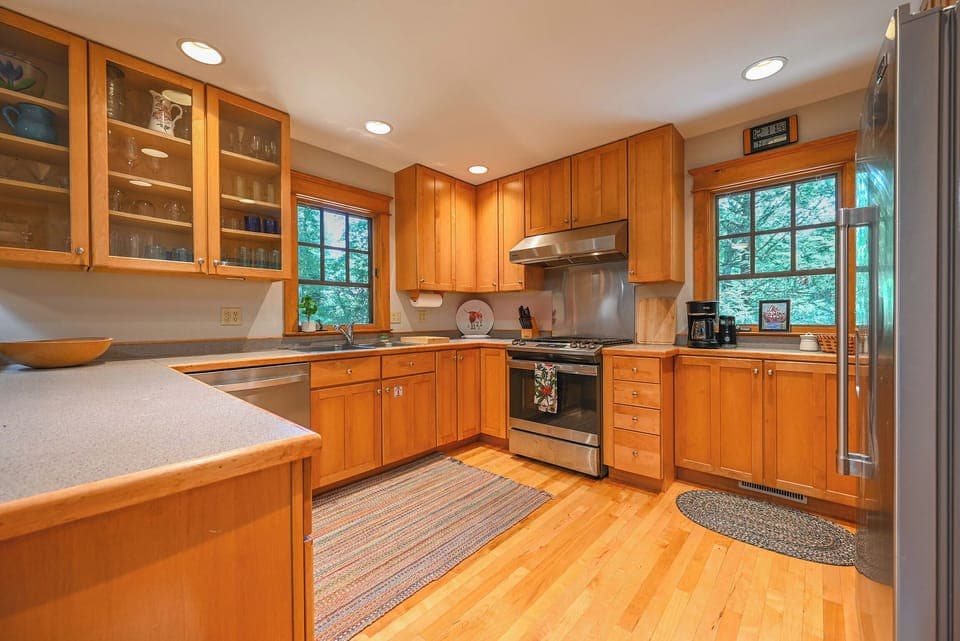 Kitchen with drip-style coffee maker, dishwasher, and gas range