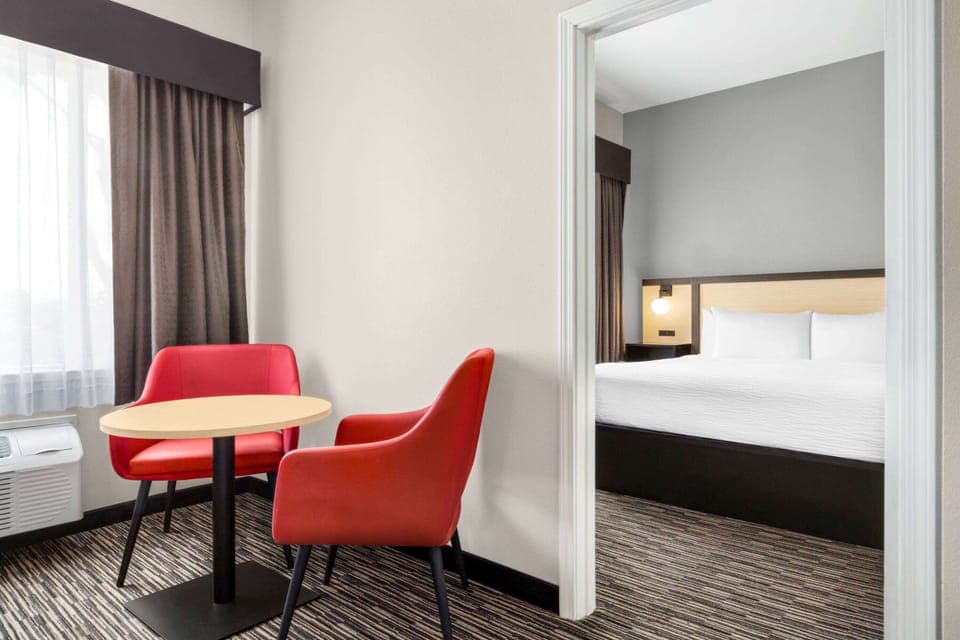 Suite, 2 King Beds, Non Smoking | In-room safe, desk, laptop workspace, blackout drapes