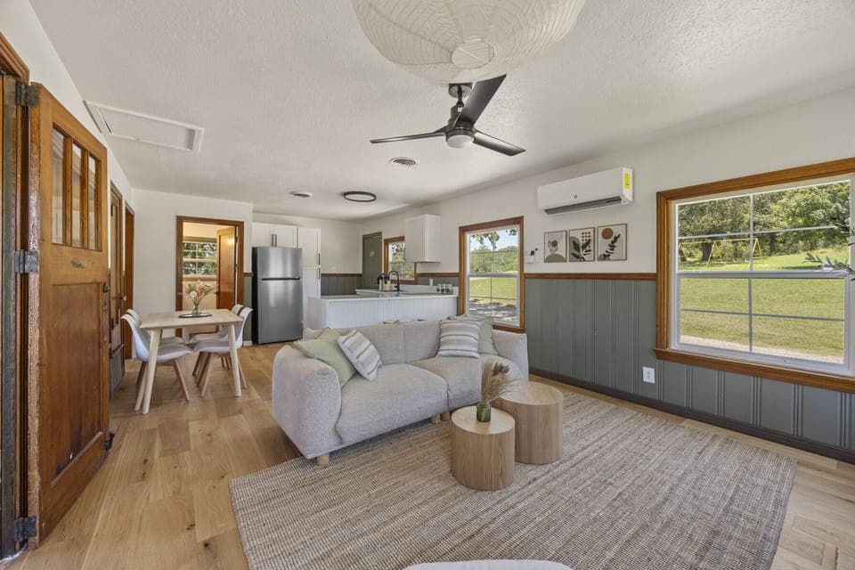 A cozy living area filled with natural light — perfect for relaxing after a day at the lake