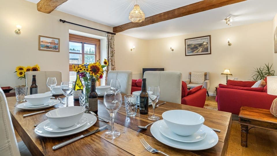 The exposed beams add a lovely touch to the living space