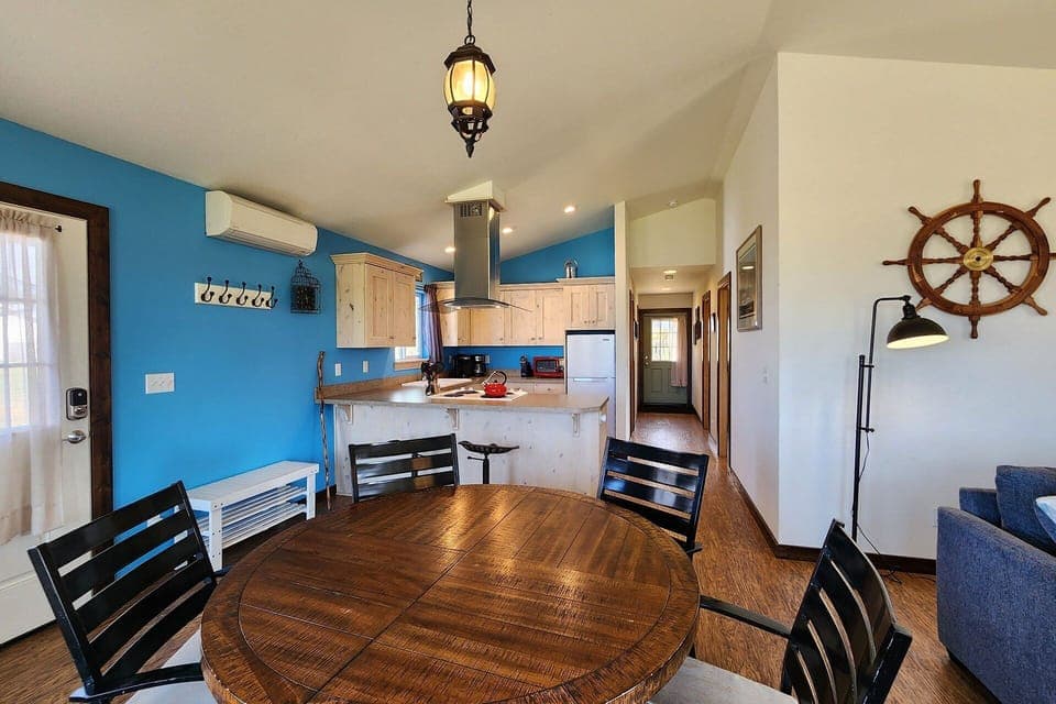 Dining table is adjacent to the kitchen.