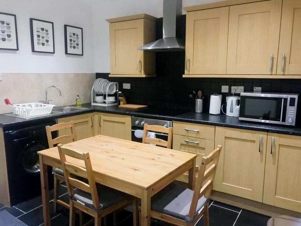 Fridge, microwave, cookware/dishes/utensils