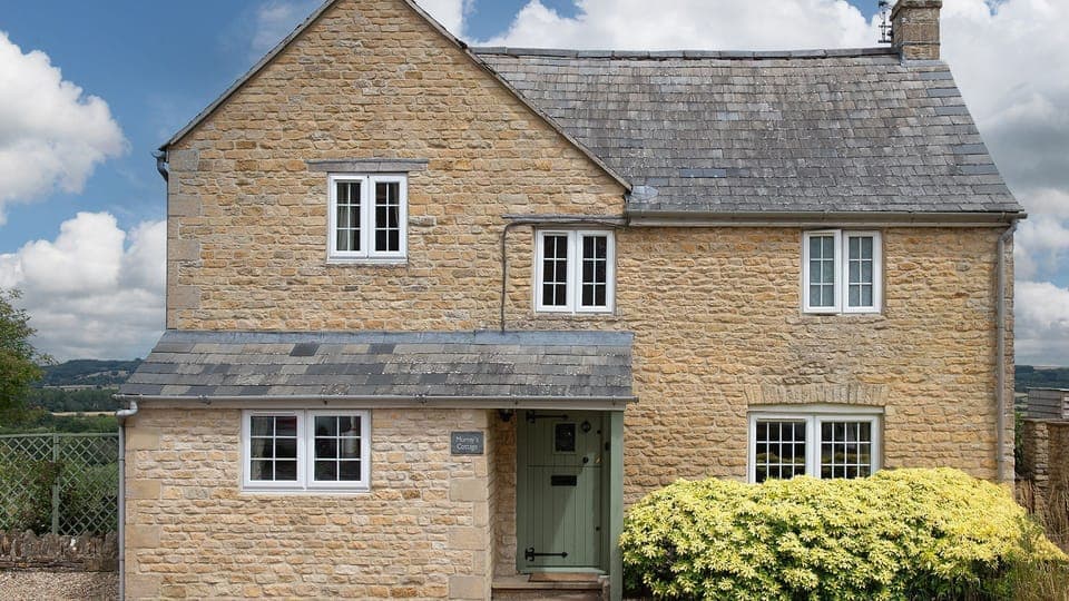 The property is built in the Cotswold stone typical of the area