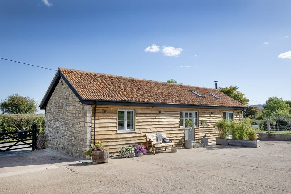 Welcome to Woodsmoke, a beautifully restored 200-year-old stone barn nestled on a charming working farm