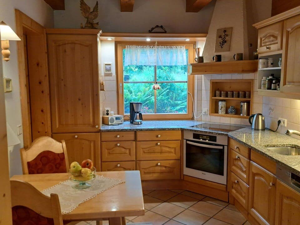 Furniture, Kitchen, Interior Design, Cabinetry, Wood, Countertop, Flooring, Kitchen Appliance, Cupboard, Floor