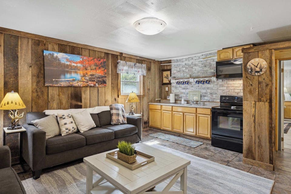 Unit B's living room with smart TV and sofa bed