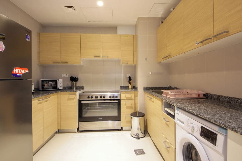 Apartment, River View | Private kitchen | Full-size fridge, microwave, oven, stovetop