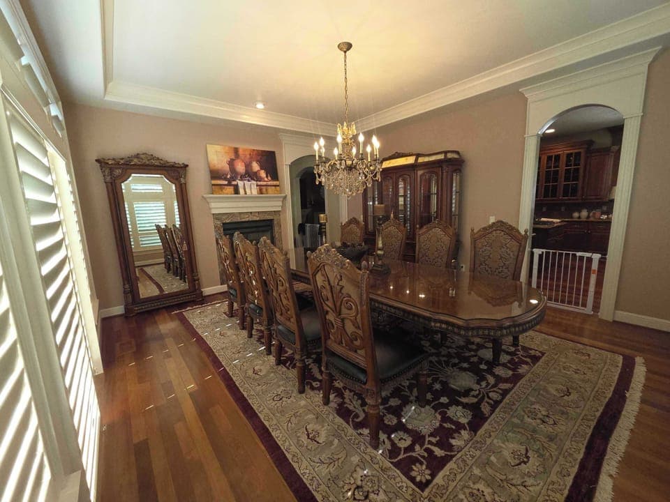 featuring a crystal chandelier and seating for eight