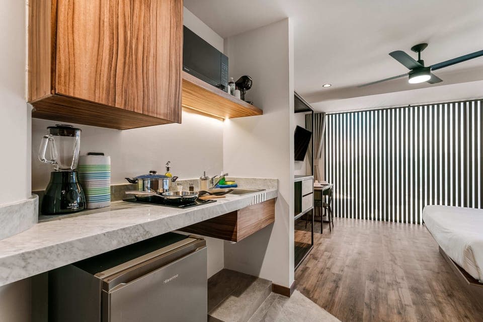 Mini-fridge, microwave, stovetop, cookware/dishes/utensils