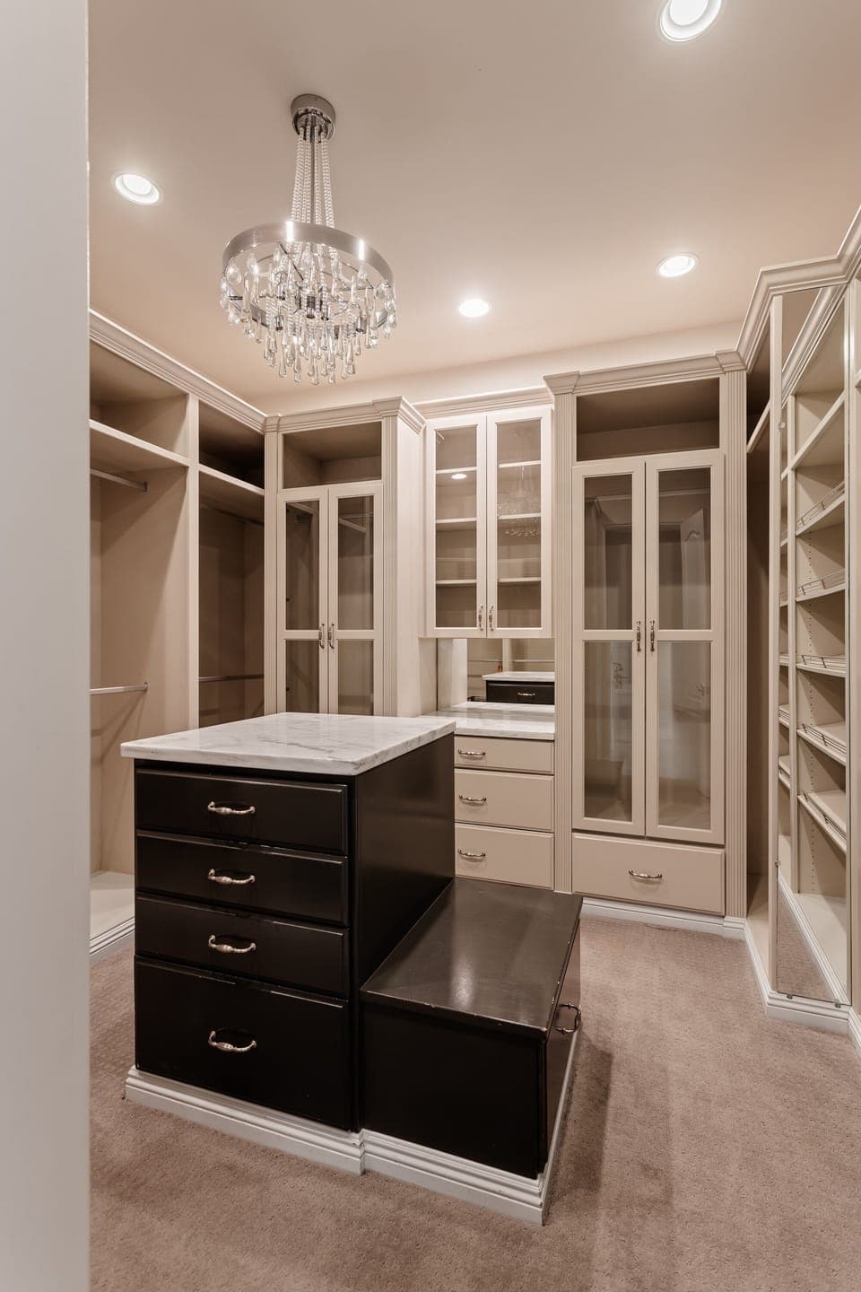 Primary Bedroom featuring a King bed, cozy furnishings, Smart TV, electric fireplace, large walk-in closet, en-suite bathroom, and access to the backyard.