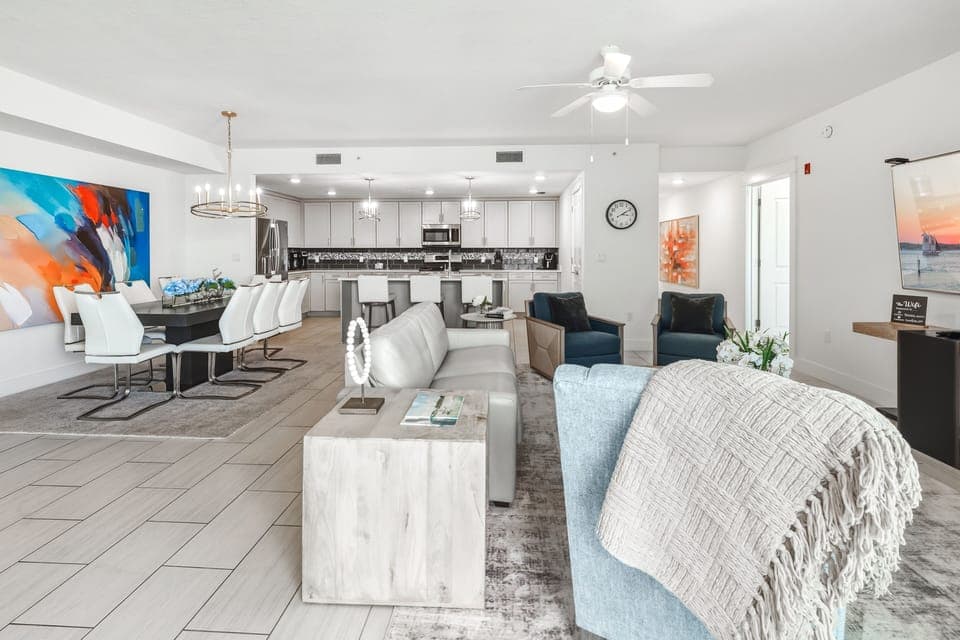 Unwind in your spacious open-concept living space, where modern comfort meets coastal style with plush seating and a fully-equipped kitchen.