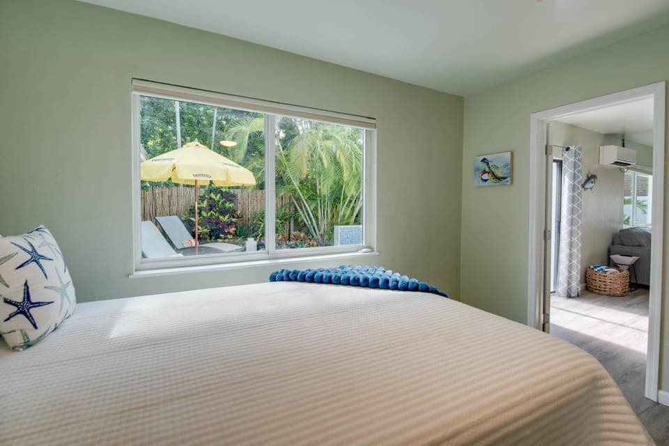 Bedroom 4 offers views overlooking the pool for a relaxing and scenic stay.