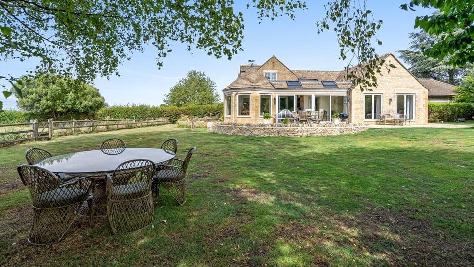 The garden is sprawling with lots of room for the children to play.