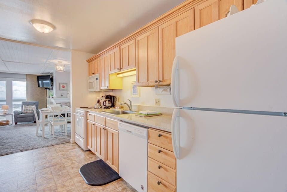 This inviting kitchen is equipped with modern appliances, offering convenience for preparing meals.