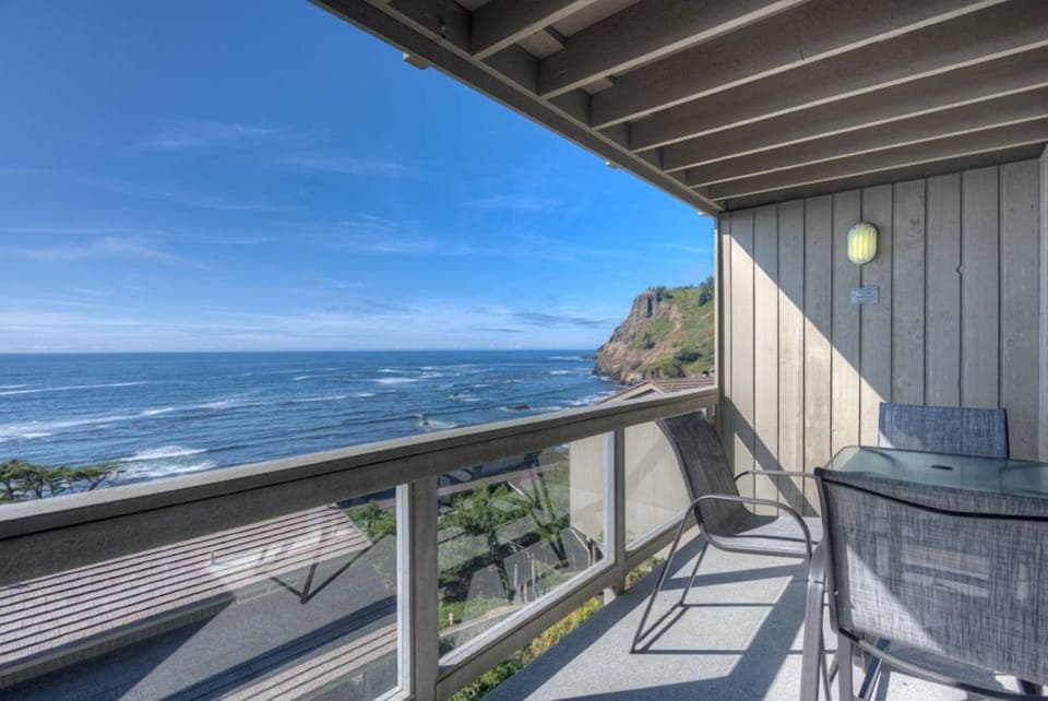 Wake up to breathtaking views with direct access to your private deck overlooking the Pacific Ocean.