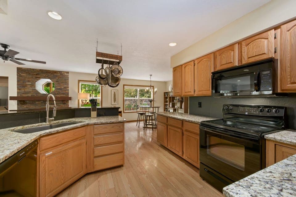 House, Multiple Beds, Patio, Garden View (2765 27th CT SW) | Private kitchen | Fridge, microwave, oven, stovetop