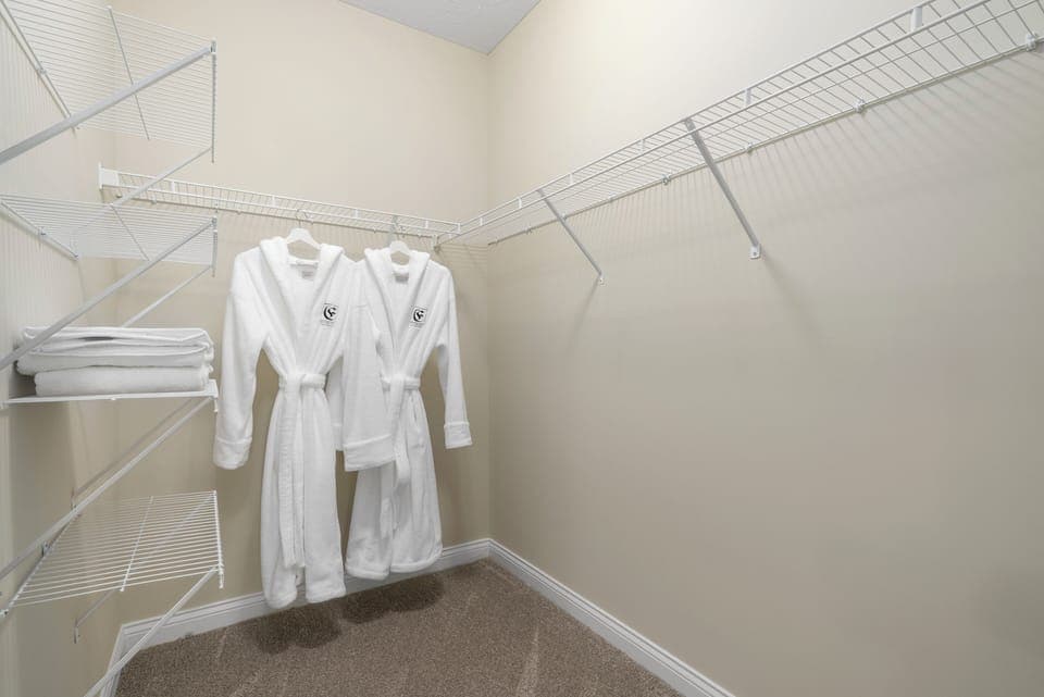 Master bedroom walk-in closet with our signature Frette hooded robes (guest favorite)