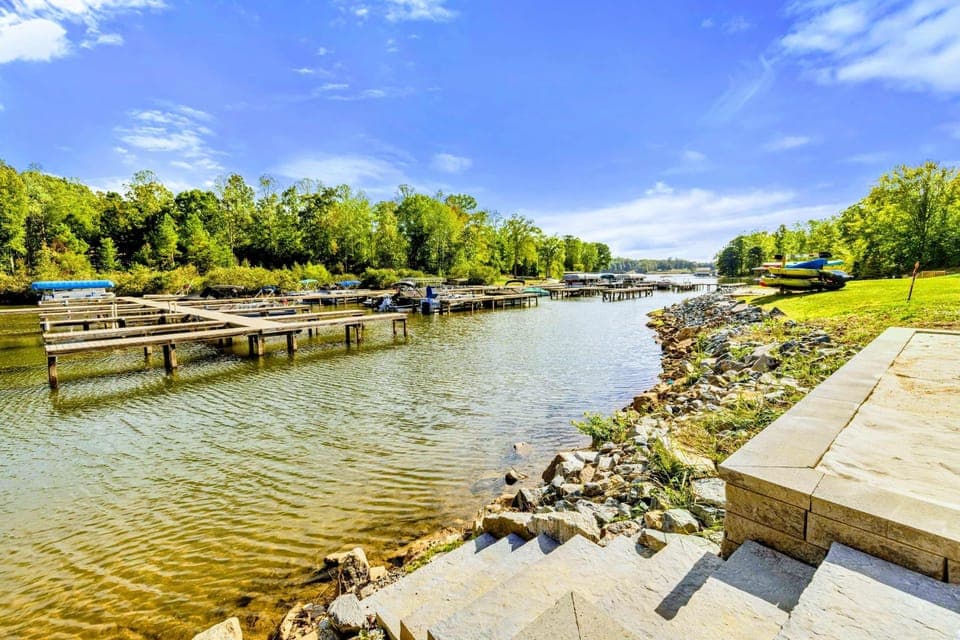 Dock and Cove - The community dock area and calm cove, with stone steps leading down from the property to the waterfront.