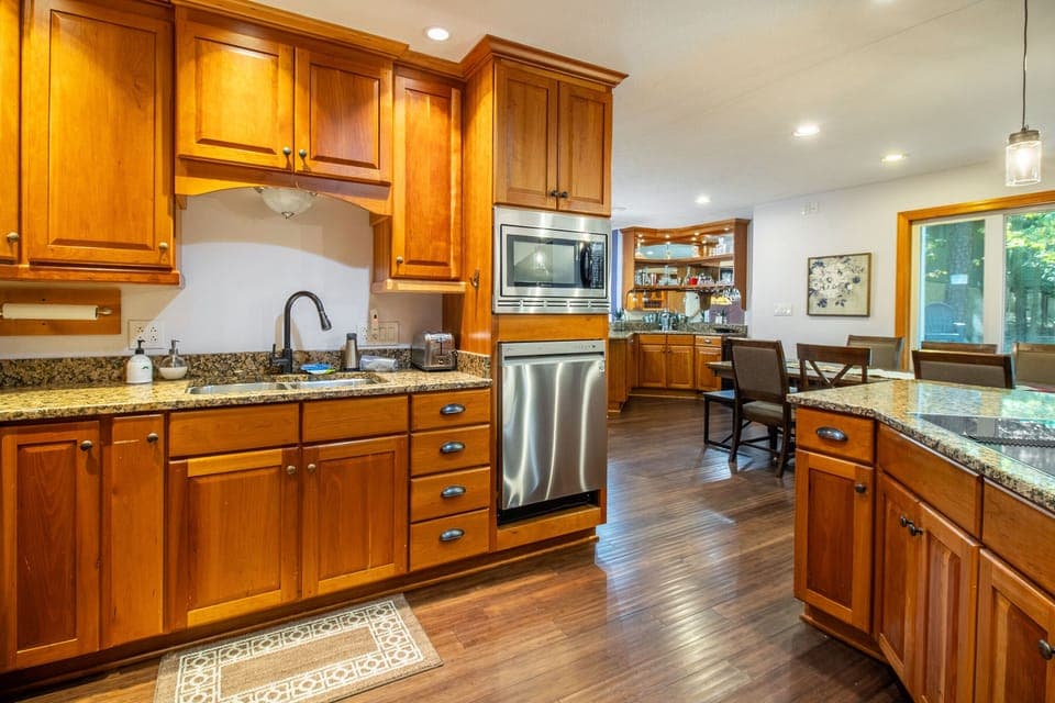 Full kitchen includes cooktop, double ovens, dishwasher, refrigerator, microwave, and more!