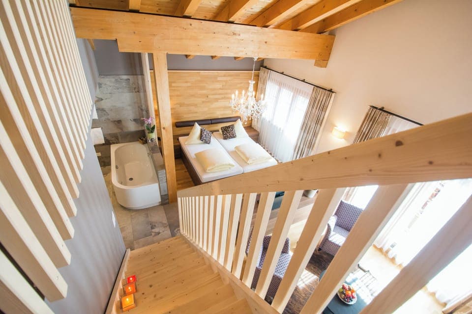 Deluxe Suite, Balcony, Mountain View | In-room safe, desk, free WiFi, bed sheets