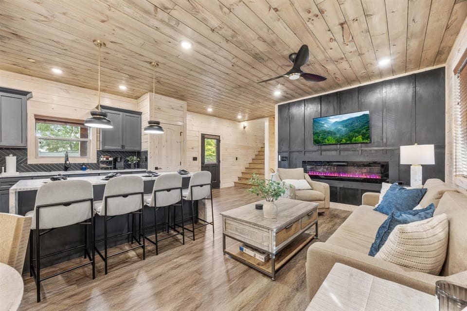 Unwind on our comfortable sofas in the open-concept living room, perfect for conversation.