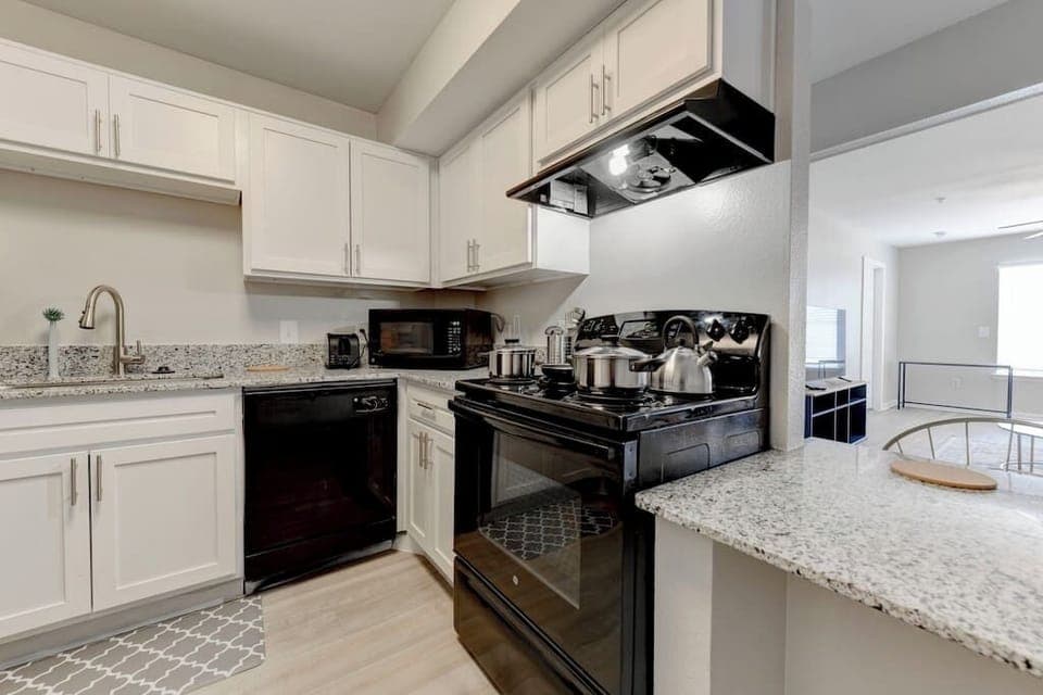Spacious kitchen w/ ample counter space & bright cabinetry