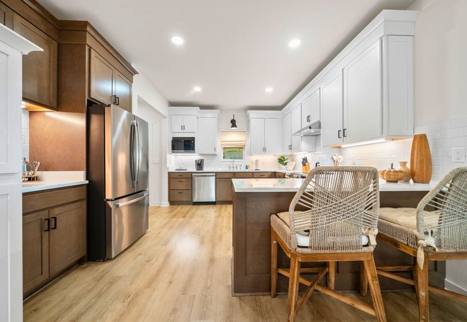 Open-concept kitchen and dining area with stainless appliances.