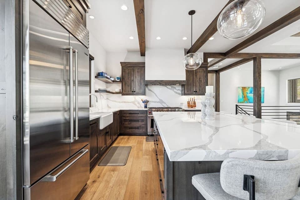 This luxurious kitchen is furnished with high end appliances and is uniquely designed.