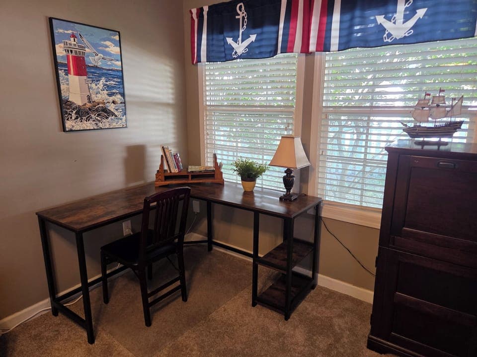 L-shaped desk/work station for work or study.  High speed internet provided.