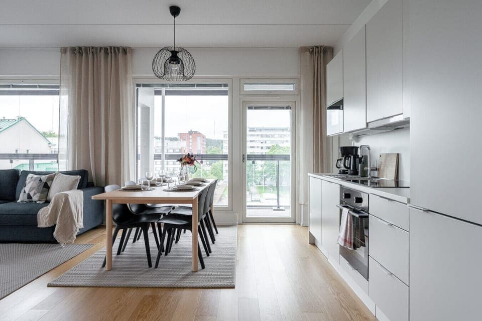 The heart of the home: an elegant dining area that seamlessly connects to the modern kitchen and living room.