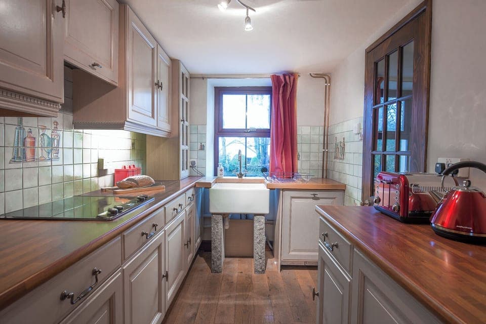 Kitchen with fridge and freezer, cooker