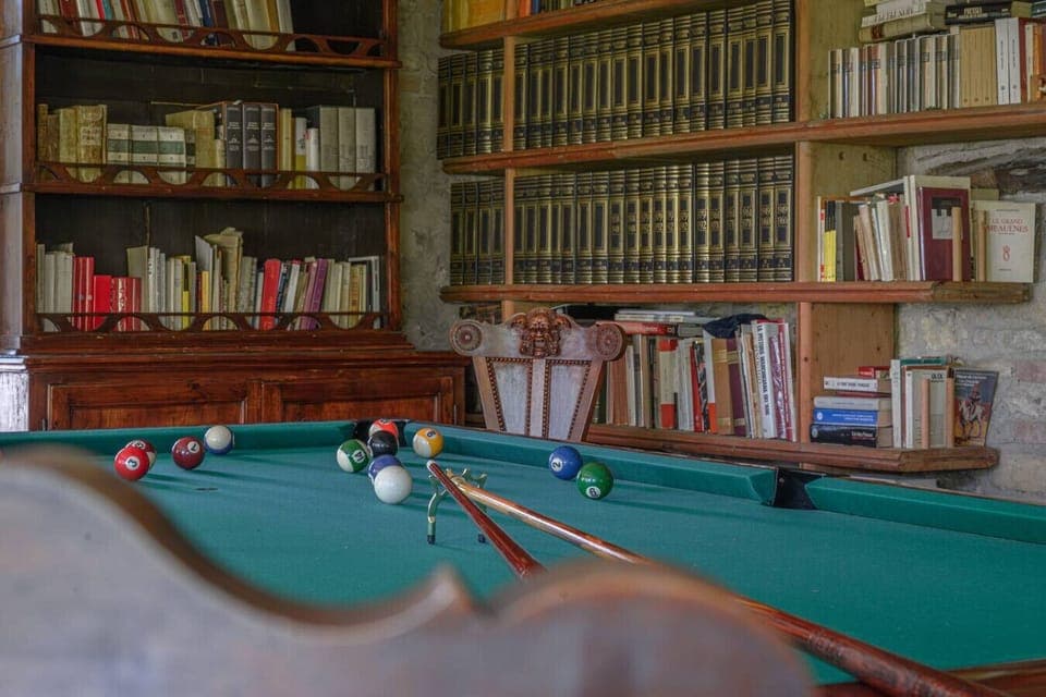 Game area with professional billiard table and ping pong table.
