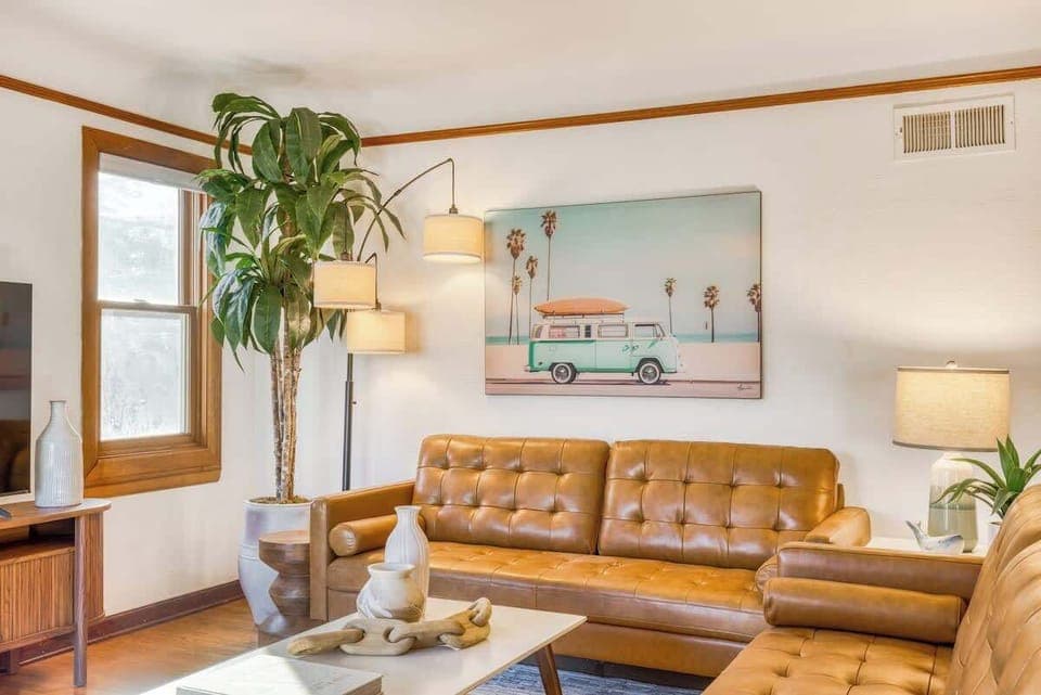 Spacious Living Room with Large Sofa & Flat-Screen TV perfect for gathering.