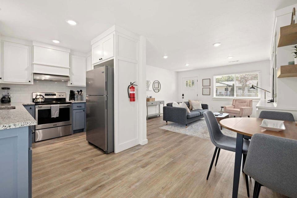  Whether you're preparing delicious meals in the fully equipped kitchen or enjoying a board game at the dining table, the seamless flow of this space ensures everyone can be part of the fun.