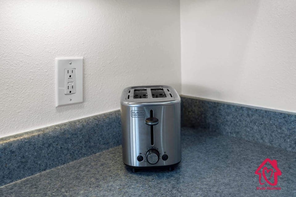 A modern toaster ready for quick and easy breakfasts during your stay.