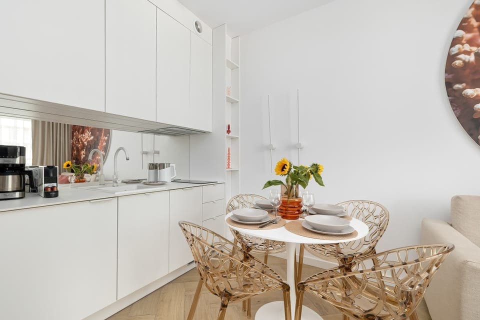 The sleek design of the kitchenette blending seamlessly with the living area.