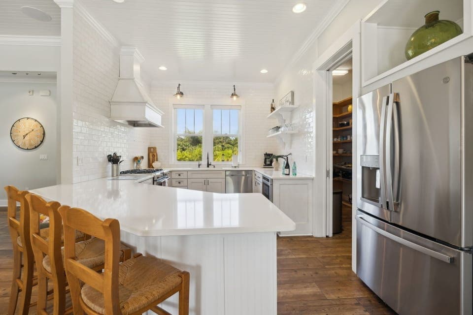 Full kitchen with stainless steel appliances: Gas stove top, oven, refrigerator, microwave, dishwasher, reverse osmosis water system, drip coffee maker, Nespresso machine, toaster, blender, crock pot, and fully stocked with all kitchen essentials.