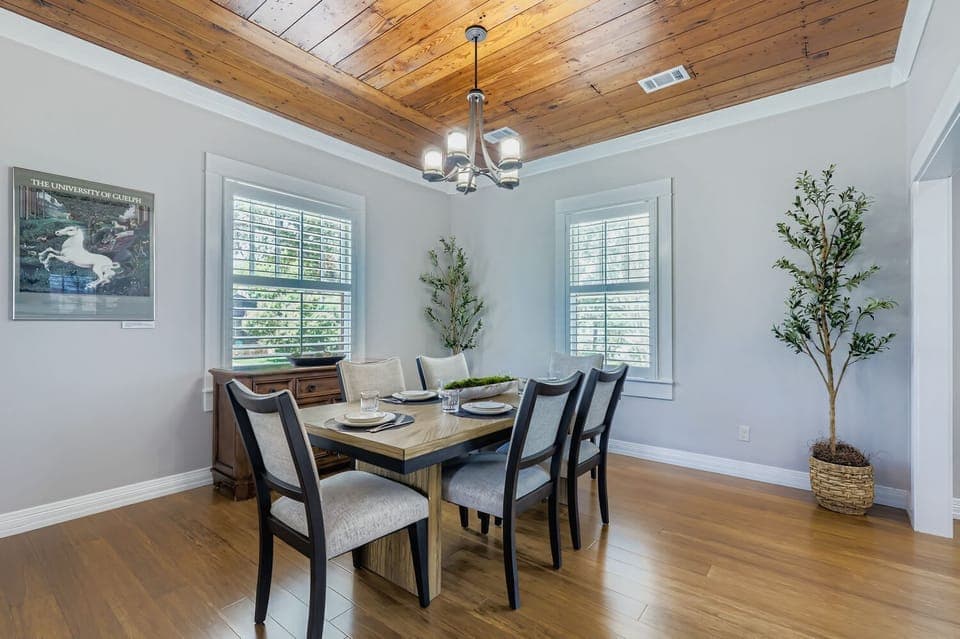 Elegant dining room with high ceilings and modern charm.