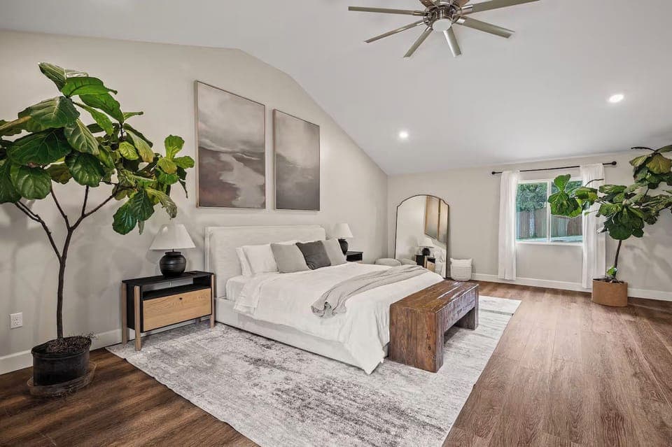 Relax in the spacious master suite with vaulted ceilings and green vibes.
