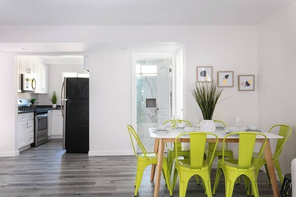 Pops of green chairs add a fresh touch to your mealtime