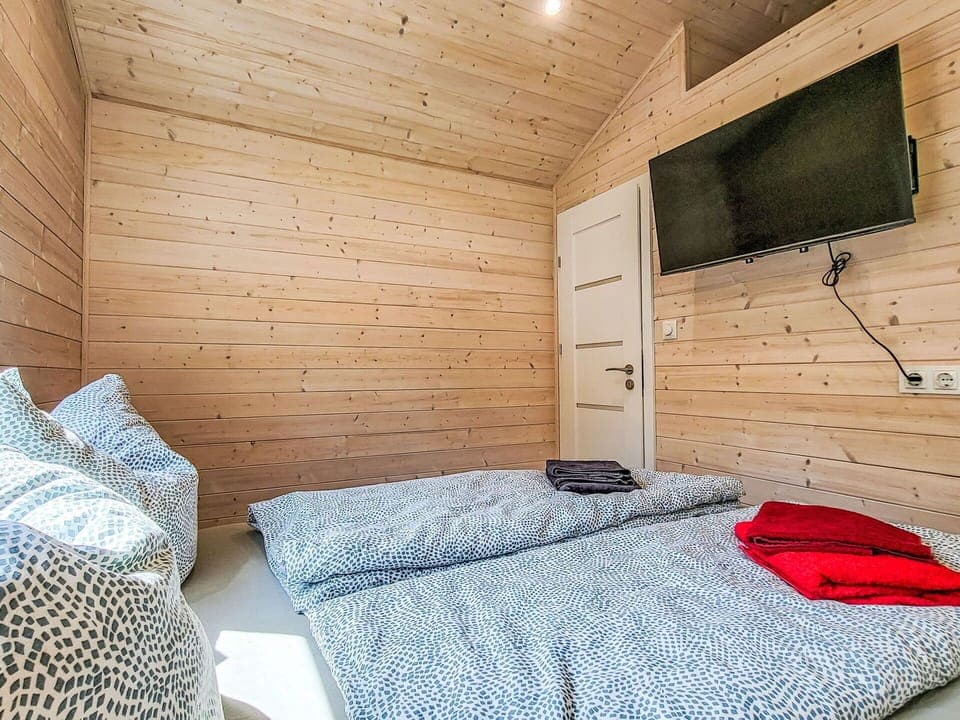 Wood, Interior Design, Flooring, Bedroom, Floor, Ceiling, Room, Furniture, Bed, Lighting