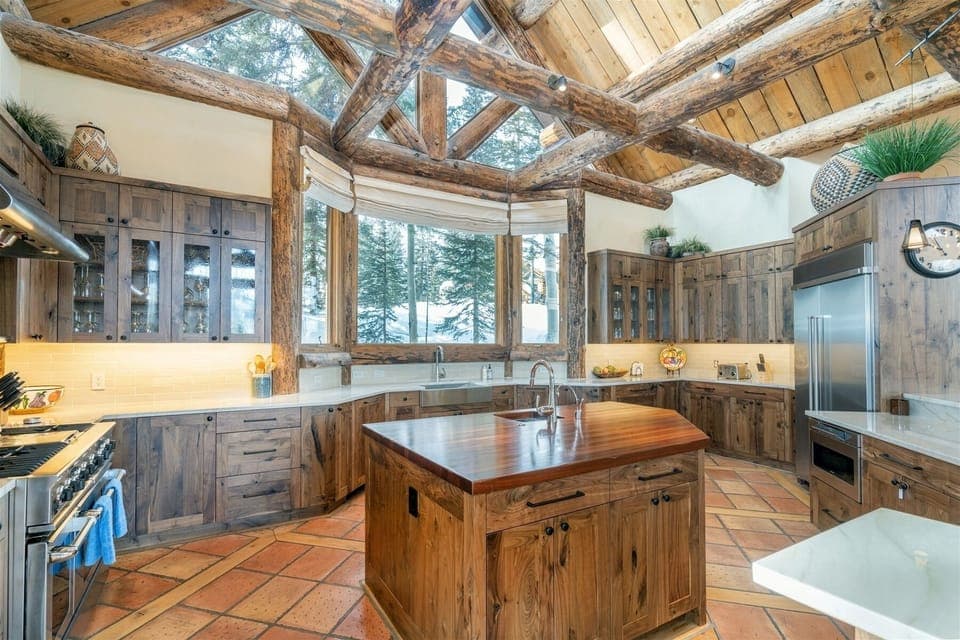Kitchen - Fully equipped with top-tier stainless steel appliances, including a gas range, dual dishwashers, wine fridge, and two sinks