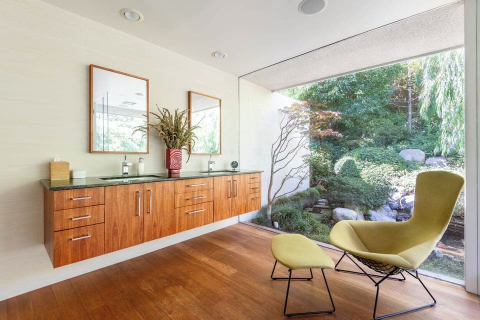 Primary bathroom with a shower overlooking a beautiful private Japanese koi pond