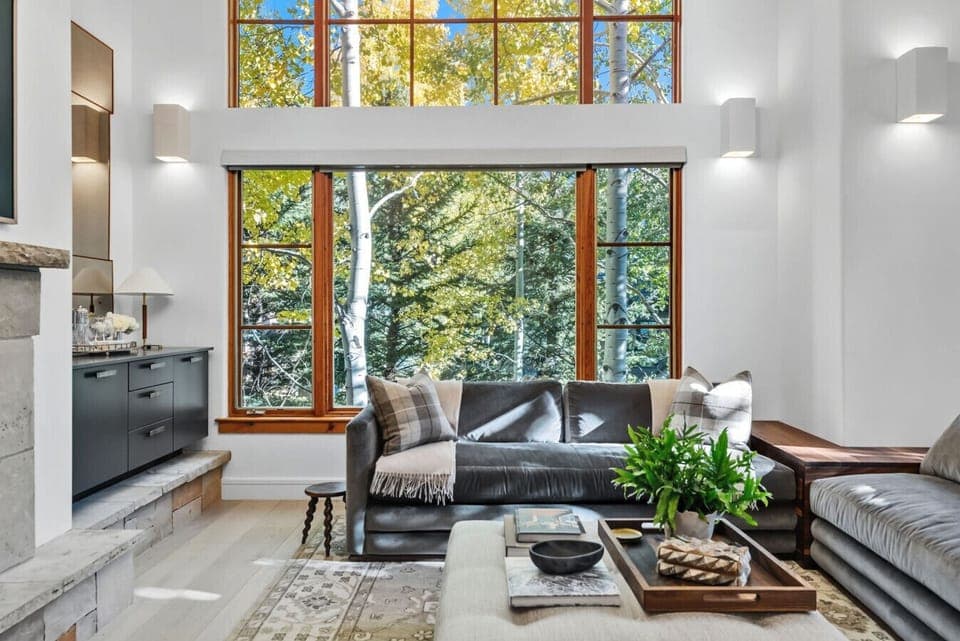 Gorgeous main living room with vaulted ceilings, huge windows, smart TV and gas fireplace