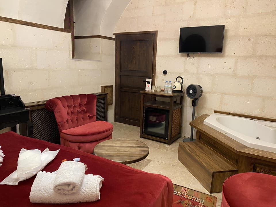 Luxury Studio Suite, Courtyard View | In-room safe, desk, soundproofing, iron/ironing board