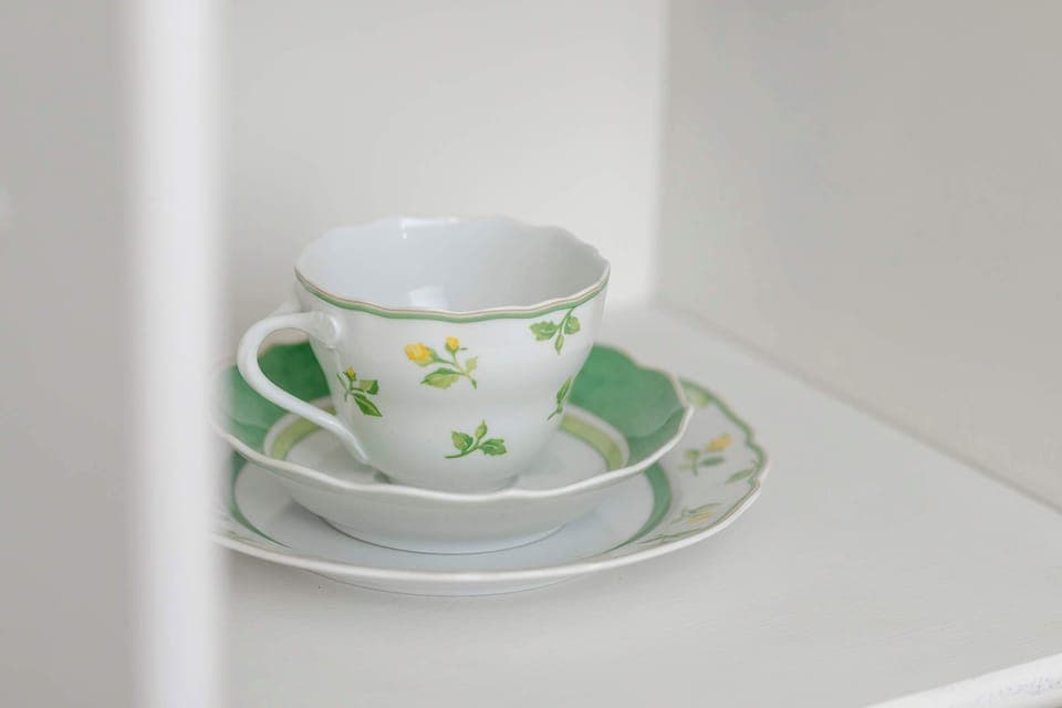 The kitchen's sleek design includes all necessary cookware and utensils.