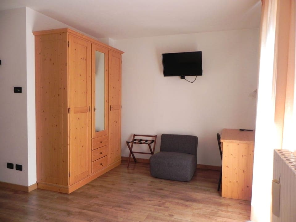 Deluxe Quadruple Room | Premium bedding, down comforters, in-room safe, iron/ironing board