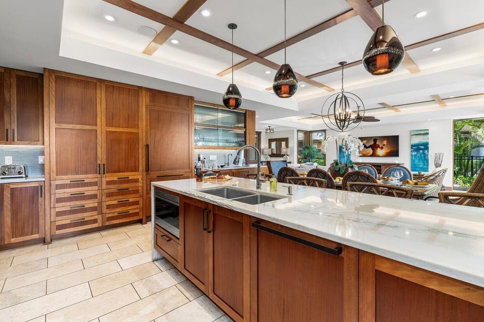 Expansive island with wine fridge and bar seating for effortless entertaining.