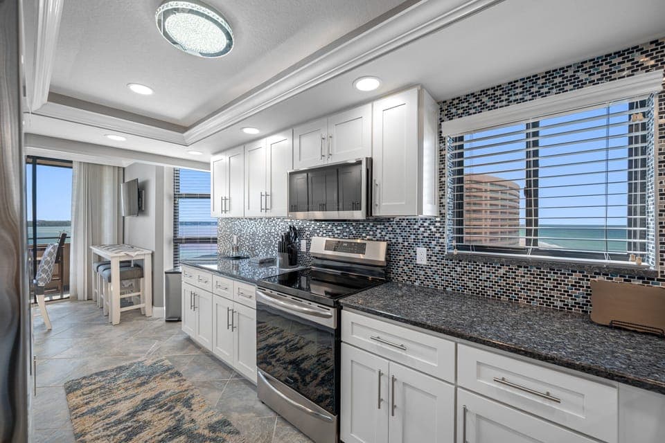 Kitchen with gorgeous tile work and amazing views!