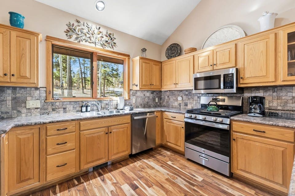 Kitchen: Main floor, drip coffee maker, Crockpot, blender, toaster, cooking utensils, tableware